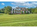 Brick house exterior with lush lawn and landscaping at 3105 W Hampton Dr, Rocky Mount, NC 27804