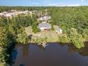 Waterfront property with a large home and detached garage at 3313 Overhead Ct, Willow Springs, NC 27592