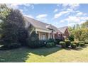 Two story brick home with a covered porch and manicured landscaping at 3313 Overhead Ct, Willow Springs, NC 27592