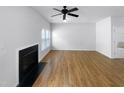 Bright living room with hardwood floors and a fireplace at 5107 Sandy Banks Rd, Raleigh, NC 27616