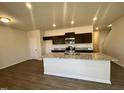 Modern kitchen with large island and dark cabinetry at 256 Bruce Dr, Dunn, NC 28334