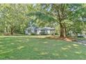 Single-story house with a large front yard at 185 Weatherbend, Pittsboro, NC 27312