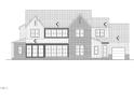 Exterior view of a two-story house with brick and gray siding, multiple windows, and a gabled roof at 5828 Norwood Ridge Dr, Raleigh, NC 27614