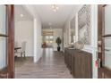 Bright and spacious entryway with hardwood floors and decorative accents at 600 Darian Woods Drive,, Holly Springs, NC 27540