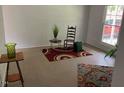 Living room with simple decor and two rugs at 205 Walton St, Durham, NC 27703