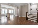 Open living space with hardwood floors and kitchen view at 836 Bankston Woods Way, Raleigh, NC 27609