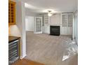 Living room with fireplace and built-in shelves at 114 Canterfield Rd, Cary, NC 27513