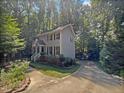 Two-story house with gray siding and brick base at 114 Canterfield Rd, Cary, NC 27513