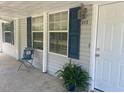 Covered front porch with seating and a view of the yard at 910 Vanco Mill Rd, Henderson, NC 27537