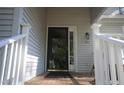 Front entry of a light gray house with brick steps at 492 Beechmast, Pittsboro, NC 27312