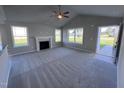 Spacious living room featuring a fireplace and vaulted ceiling at 194 Lotus Ave, Smithfield, NC 27577