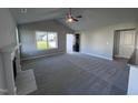Spacious living room featuring a fireplace and high ceilings at 194 Lotus Ave, Smithfield, NC 27577