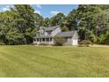 Two-story house with a porch and large lawn at 1001 Yopon Ct, Raleigh, NC 27603