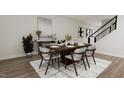 Elegant dining room with wooden table and modern chairs at 4038 Elk Creek Ln # 60, Raleigh, NC 27612