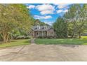 Brick ranch house with a circular driveway at 1100 Branch Chapel Church Rd, Selma, NC 27576