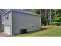 Gray two story house with a white garage door at 700 Quail Ct, Creedmoor, NC 27522