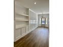 Bright entryway with built-in shelving and wood flooring at 15 Bella Ln, Zebulon, NC 27597