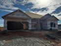 A new construction home with a covered entrance and front yard at 28 Decatur Dr, Fuquay Varina, NC 27526