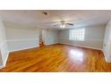 Hardwood floor living room with access to upper level at 5141 Nc 56, Franklinton, NC 27525