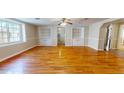 Living room with hardwood floors and built-in shelving at 5141 Nc 56, Franklinton, NC 27525