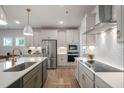 Modern kitchen with stainless steel appliances and a large island at 85 Claude Creek Way, Smithfield, NC 27577