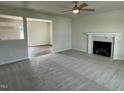 Spacious living room with a fireplace and carpet at 80 Lotus Ave, Smithfield, NC 27577