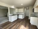 Modern kitchen with white cabinets and stainless steel appliances at 80 Lotus Ave, Smithfield, NC 27577