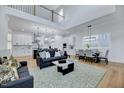 Spacious great room with high ceilings, open floor plan, and a cozy seating area at 524 Kings Lake Way, Durham, NC 27703