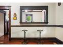 Two vintage-style barstools sit at a kitchen pass-through at 1502 Bahama Rd, Bahama, NC 27503