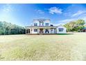 Stunning two-story farmhouse with a large front yard at 997 Jackson Rd, Fuquay Varina, NC 27526