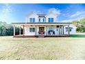 Two story farmhouse with large front porch and expansive lawn at 997 Jackson Rd, Fuquay Varina, NC 27526