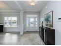 Front entry with hardwood floors and a view to the living room and front yard at 591 Glenkirk Pl # 106, Garner, NC 27529
