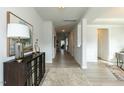 Bright and spacious entryway with hardwood floors and a view to the living room at 591 Glenkirk Pl # 106, Garner, NC 27529