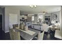 Bright dining room with a farmhouse style table and chairs at 2001 Puffin Dr # 201, Haw River, NC 27258