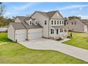 Two-story house with three-car garage and large yard at 122 Whimbrel Ct, Lillington, NC 27546