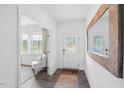 Bright and airy entryway with a large mirror and a view into the living room at 388 Blue Aspen Dr, Fuquay Varina, NC 27526