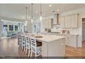 Modern kitchen with large island and stainless steel appliances at 115 Black Walnut Dr # 193, Garner, NC 27529