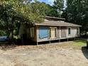 Rustic one-story home with wooden siding needing some repairs at 255 Roberts Ave, Henderson, NC 27537