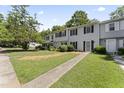 Townhouse exterior with landscaping and walkway at 15 Providence Ct, Durham, NC 27705