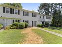 Townhouse exterior with landscaping and walkway at 15 Providence Ct, Durham, NC 27705
