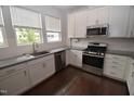 Modern kitchen with stainless steel appliances at 725 Traditions Grande Blvd, Wake Forest, NC 27587