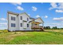 Rear view of farmhouse with large deck at 3408 Apple Meadow Dr, Fuquay Varina, NC 27526