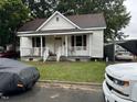 White house with front porch and small yard at 206 S Ethel St, Selma, NC 27576