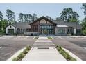 Community clubhouse with modern design and ample parking at 517 Still Willow Ln, Wendell, NC 27591