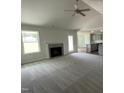 Spacious living room with a fireplace and high ceilings at 152 Lotus Ave, Smithfield, NC 27577