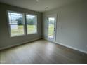 Versatile bonus room with hardwood floors and access to the backyard at 116 Lotus Ave, Smithfield, NC 27577