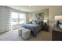 Spacious bedroom with large window, neutral wall colors, and ample natural light at 1769 Old Fields Blvd, Haw River, NC 27258