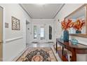 Building entry with elegant flooring and decor at 215 Eyam Hall Ln, Apex, NC 27502