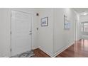 Unit entry with wood floors and simple decor at 215 Eyam Hall Ln, Apex, NC 27502
