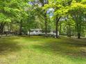 Charming ranch home nestled on a large wooded lot at 3015 Old Raleigh Rd, Apex, NC 27502